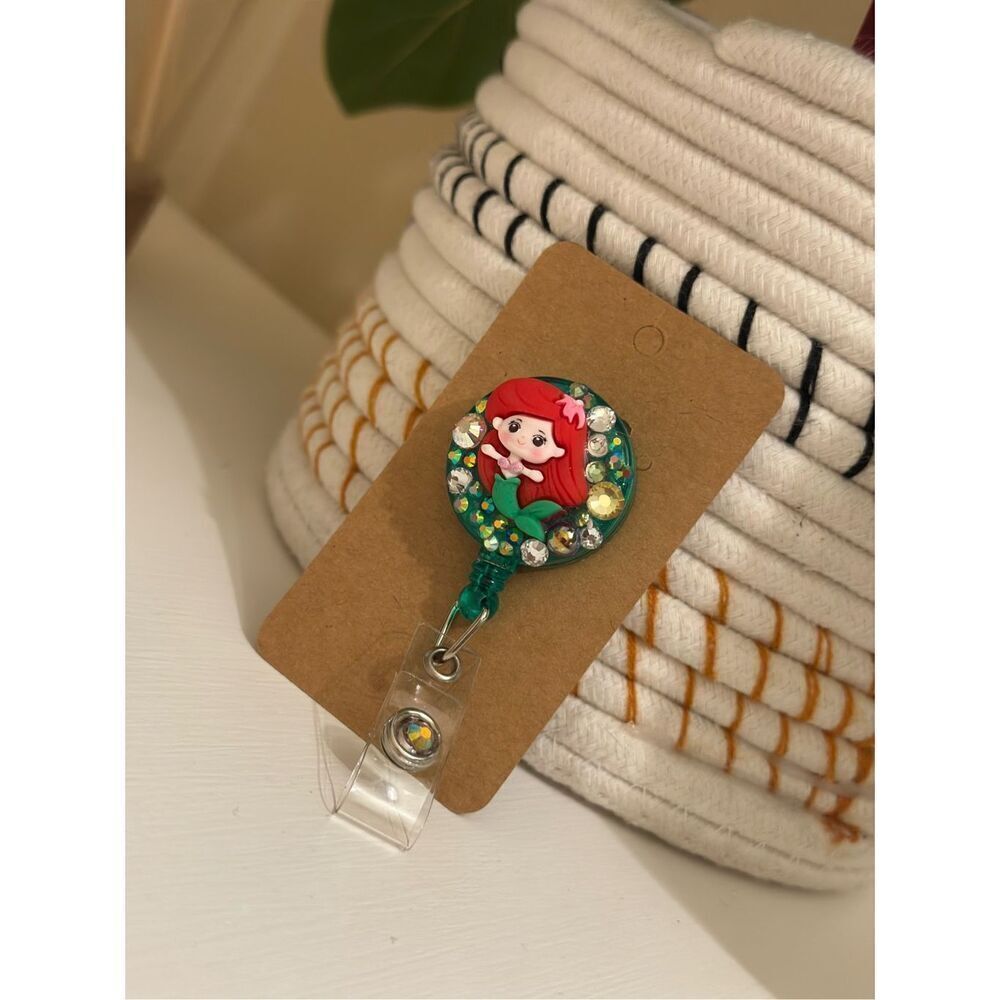 The Little Mermaid Ariel Rhinestone Red and Green Badge Reel - Picture 1 of 2